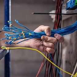 About Us 2 Expert Checking the Wires